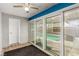 Enclosed sunroom featuring a ceiling fan and sliding glass doors leading to a pool at 3696 Monte Verde St, Las Vegas, NV 89121