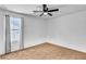 Bright bedroom with natural light, neutral carpet, and a ceiling fan offers a comfortable retreat at 3757 Via Gennaro, Henderson, NV 89044