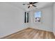 Cozy bedroom featuring hardwood floors, neutral walls, and a ceiling fan at 3757 Via Gennaro, Henderson, NV 89044