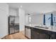 Modern kitchen featuring stainless steel appliances, dishwasher and large island at 3757 Via Gennaro, Henderson, NV 89044