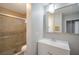 Stylish bathroom featuring a tiled shower with a glass door and modern vanity at 3966 Torsby Pl, Las Vegas, NV 89119