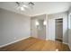 Bright bedroom with hardwood floors, closet and a well-lit mirror at 3966 Torsby Pl, Las Vegas, NV 89119