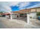 Attached covered parking area with gated access and room for multiple vehicles or outdoor activities at 3966 Torsby Pl, Las Vegas, NV 89119