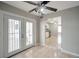 Bright dining area with tile flooring, ceiling fan and door to patio at 3966 Torsby Pl, Las Vegas, NV 89119