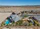 Wide aerial shot displays the property with pool, landscaping, and mountain backdrop at 4081 Turquoise Falls St, Las Vegas, NV 89129