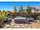 Inviting backyard featuring a modern fire pit surrounded by comfortable outdoor seating at 4081 Turquoise Falls St, Las Vegas, NV 89129