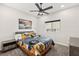 Cozy bedroom featuring hockey themed decor, ceiling fan, and natural light at 4081 Turquoise Falls St, Las Vegas, NV 89129