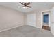 Neutrally painted bedroom featuring carpet, ceiling fan, and closet at 4116 Free Bird Crest Ave, North Las Vegas, NV 89081