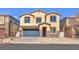 Charming two-story home with a blue garage door and low maintenance landscaping at 4116 Free Bird Crest Ave, North Las Vegas, NV 89081