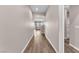 Inviting hallway with archway, light tan paint, and wood-look floors at 4116 Free Bird Crest Ave, North Las Vegas, NV 89081