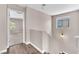 Bright hallway with hardwood floors and neutral paint, creating a seamless transition between living spaces at 4116 Free Bird Crest Ave, North Las Vegas, NV 89081