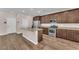 Kitchen featuring stainless steel appliances, wood cabinets, and granite countertops at 4116 Free Bird Crest Ave, North Las Vegas, NV 89081