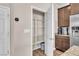 Convenient pantry space with shelves, adjacent to the kitchen and stainless refrigerator at 4116 Free Bird Crest Ave, North Las Vegas, NV 89081