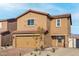 Charming two-story home featuring a classic stucco facade and a red tile roof at 4211 Gold Desert St, North Las Vegas, NV 89032