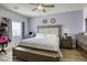 Bright bedroom featuring a ceiling fan, a computer desk, and a beautiful bed with a padded headboard at 4260 E Cincinnati Ave, Las Vegas, NV 89104