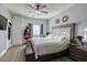 Spacious bedroom features a ceiling fan, accent wall decorations, and a decorative wooden bedframe at 4260 E Cincinnati Ave, Las Vegas, NV 89104