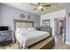 Large bedroom featuring a desk and chair, and a decorative padded headboard on the bed at 4260 E Cincinnati Ave, Las Vegas, NV 89104