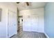 Bedroom featuring three doors and flooring with a wood-look pattern at 4260 E Cincinnati Ave, Las Vegas, NV 89104