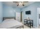 Cozy bedroom furnished with bed, wardrobe, and small dining set at 4260 E Cincinnati Ave, Las Vegas, NV 89104