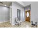 Welcoming foyer with tile floors, a modern mirror, and a stylish chair at 4260 E Cincinnati Ave, Las Vegas, NV 89104