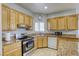 Modern kitchen with stainless steel appliances, granite counters, and a view from the window at 4260 E Cincinnati Ave, Las Vegas, NV 89104