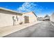 Spacious backyard featuring a large concrete patio and durable concrete perimeter walls at 4303 E Viking Rd, Las Vegas, NV 89121