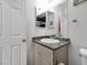 A well-maintained bathroom features a vanity with granite countertops and a mirrored cabinet for storage and convenience at 4303 E Viking Rd, Las Vegas, NV 89121