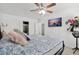 Comfortable bedroom featuring a ceiling fan and mounted TV for relaxation at 4303 E Viking Rd, Las Vegas, NV 89121