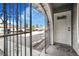 View of front door with wrought iron gate, offering security and curb appeal at 4303 E Viking Rd, Las Vegas, NV 89121