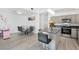 Modern kitchen featuring stainless steel appliances, gray cabinetry, and a granite island at 4303 E Viking Rd, Las Vegas, NV 89121