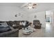 Cozy living room with sectional sofa, glass tables, and light-filled ambience at 4303 E Viking Rd, Las Vegas, NV 89121