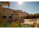 Inviting backyard boasts a sparkling pool, mature landscaping, and a covered patio area for relaxed outdoor living at 4384 Grey Spencer Dr, Las Vegas, NV 89141