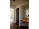 Bathroom vanity area with marble countertop, mirror, and stool, blending comfort and style at 4384 Grey Spencer Dr, Las Vegas, NV 89141