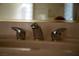 Bathroom sink featuring a contemporary chrome faucet and a light-toned counter, stylish and functional at 4384 Grey Spencer Dr, Las Vegas, NV 89141