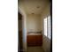 Vanity area in bathroom with cabinet storage, tile flooring, and natural light at 4384 Grey Spencer Dr, Las Vegas, NV 89141