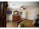 Bedroom with wood floors, ceiling fan, and a television at 4384 Grey Spencer Dr, Las Vegas, NV 89141