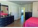 Bright bedroom featuring hardwood floors, and pink bedding on the bed at 4384 Grey Spencer Dr, Las Vegas, NV 89141