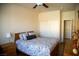 This is a cozy bedroom with a closet, dresser, wood floors, and ceiling fan at 4384 Grey Spencer Dr, Las Vegas, NV 89141