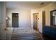 Bedroom features a large closet, neutral colors, and a blue dresser, and carpeted floors at 4384 Grey Spencer Dr, Las Vegas, NV 89141