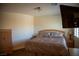 Bedroom featuring hard wood floors, a window and a flat-screen TV at 4384 Grey Spencer Dr, Las Vegas, NV 89141