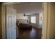 Spacious bedroom with hardwood floors, ceiling fan, and natural light from shuttered window at 4384 Grey Spencer Dr, Las Vegas, NV 89141