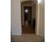 Hallway with tile flooring and archway, connecting different areas of the home at 4384 Grey Spencer Dr, Las Vegas, NV 89141