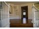 Hallway with wood floors, white railings, arched doorways, and decorative wall art for an inviting feel at 4384 Grey Spencer Dr, Las Vegas, NV 89141