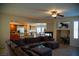 Cozy living room with fireplace, media niche, and open floor plan to kitchen at 4384 Grey Spencer Dr, Las Vegas, NV 89141