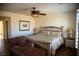 Serene main bedroom featuring a ceiling fan, hardwood floors and natural light from a window at 4384 Grey Spencer Dr, Las Vegas, NV 89141