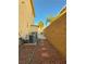 Side yard with air conditioning units, rock landscaping and brick pavers at 4384 Grey Spencer Dr, Las Vegas, NV 89141