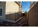 Narrow side yard with brick pavers and rock landscaping at 4384 Grey Spencer Dr, Las Vegas, NV 89141