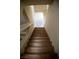 Elegant wooden staircase with light-colored walls, creating a bright and inviting transition between floors at 4384 Grey Spencer Dr, Las Vegas, NV 89141