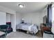 Cozy bedroom with neutral carpet, a ceiling light, and closet storage at 4505 Providence Ln, Las Vegas, NV 89107