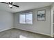 Bedroom features a ceiling fan, carpet flooring and natural light from window at 4505 Providence Ln, Las Vegas, NV 89107